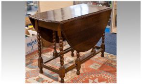 Early 20th Century Oak Gate-leg Table, circa 1920, of two-leaf oval form, raised on barley twist