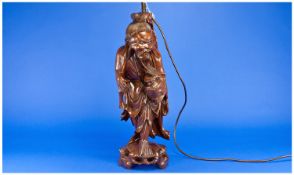 Chinese Early 20th Century Cherrywood Immortals Figural Lamp. Stands 23`` in height.