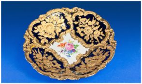 A Fine Quality Meissen Embossed Bowl with fined gold raised decoration with a floral palette to