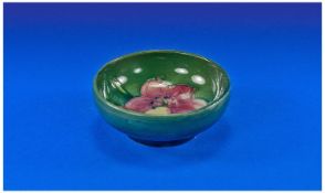 Moorcroft Miniature Pin Bowl, `Clematine` design on green ground. 3.25 inches diameter