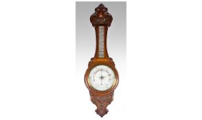 Victorian Oak Carved Banjo-Aneroid Barometer. with well carved features with thermometer and