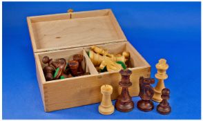 Carved Wooden Chess Piece Set, with half in a pale wood, probably boxwood, with the others being