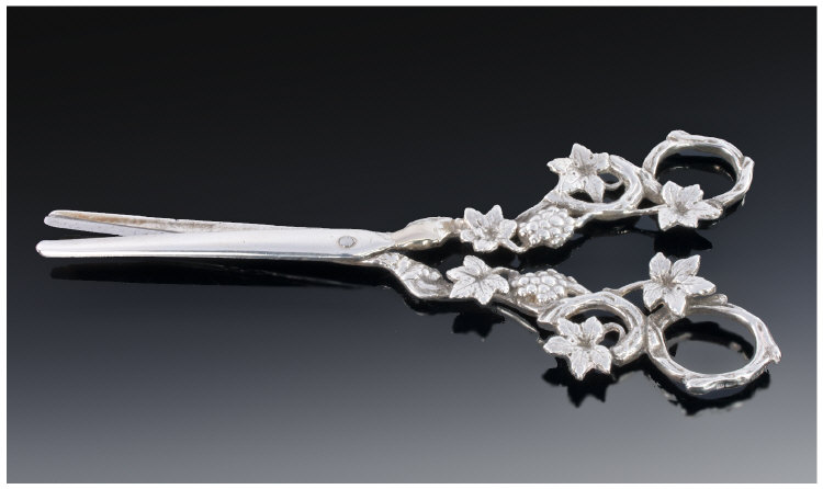 A Pair Of Silver Grape Scissors, the handles cast as fruiting vines. London import mark for 1927