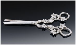 A Pair Of Silver Grape Scissors, the handles cast as fruiting vines. London import mark for 1927