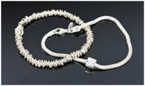 Two Silver Bracelets.