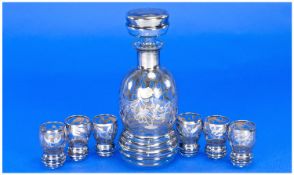 A Sterling Silver Overlay Glass Decanter with set of six matching tots, with label reads `Argento