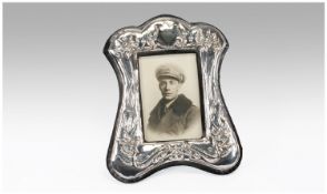 Art Nouveau Style Silver Photo Frame, hallmarked London 1973, stands 7.25 inches high.