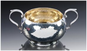 A Quality American Sterling Silver Sugar Bowl of round shape with two scroll handles. Hand planished