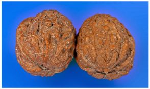 Pair of `Hediao` Walnut Kernels, the outside carved to depict the origianl followers of Buddha, `The