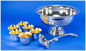 Large Silver Plated Punch Bowl, raised on pedestal base, with serving spoon and six beakers, the