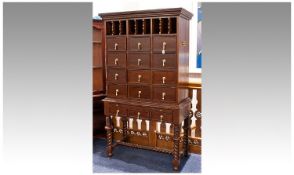 Large Modern Cabinet of Stand, comprising four rows of three drawers, raised on a stand with moulded