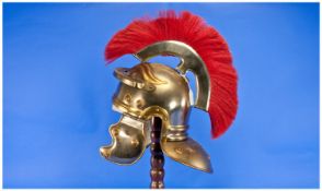 Troy Style Helmet with Red Plume, Raised On A Wooden Stand.