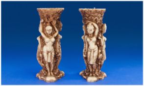 Pair of Resin Figural Vases, each with three Egyptian style female figures, each measuring 9
