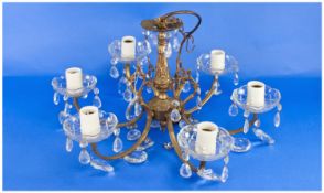 Rococo Style Six Branch Chandelier with scallop edged, cup shaped `drip trays` and white faux candle
