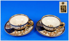 Satsuma Pair Of Meji Period Cups & Saucers, decorated with images of the immortals with gold &