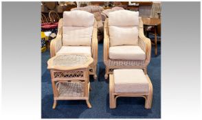 Four Piece Wicker Conservatory Suite, comprising two armchairs, stool and a table, the armchairs