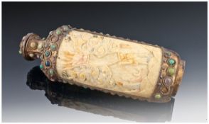 A Chinese Ivory & Metal Perfume Bottle carved with fiery dragons. Some stone inserts to the