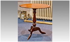 Late Victorian Mahogany Tripod Table, the oval top raised on heavy conical and globe turned