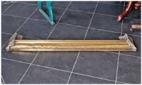 Early 20th Century Brass Fender, with scrolled decoration to front, measuring 53 inches wide.
