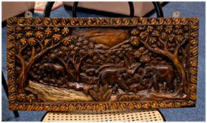 Oriental Carved Wall Hanging Hardwood Panel, depicting two elephants in a forest setting, carved