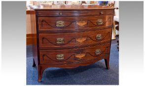 George III Mahogany Bow-Fronted Chest of Drawers, circa 1780, decorated with inlay in the manner