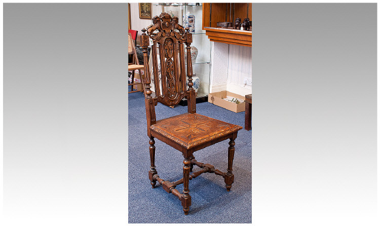 Late Victorian Oak Hall Chair, in the Carolean style, the crest rail carved with lions, the back