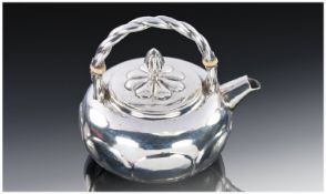 A Fine Silver Teapot Of Compressed Round Melon Shape. Panelled sides, overhead rope twist handle and