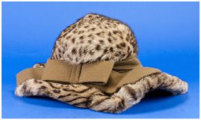 Mitzi Lorenz Ocelot Fur Hat, wide brim narrowing to the back, ruched taupe band with large