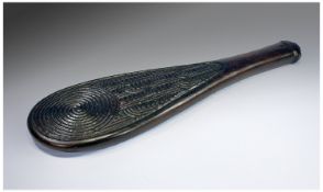 New Zealand (Maori) Interest. A treen paddle shaped item carved to both sides with traditional