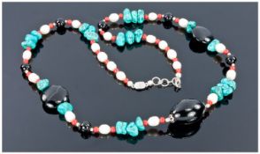 Turquoise, Black Onyx, Freshwater Pearl and Coral Necklace with sterling silver spacers, designer