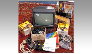 Amstrad 1980`s Games Computer, with a collection of gaming cassettes, a monitor, various