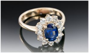 14ct Gold Diamond And Sapphire Ring, Central Oval Cut Sapphire Surrounded By 12 Round Cut