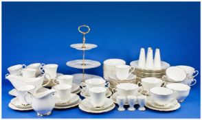 Large White Porcelain Sheltonian Dinner Service, all pieces with gilt rims, comprising 8 dinner
