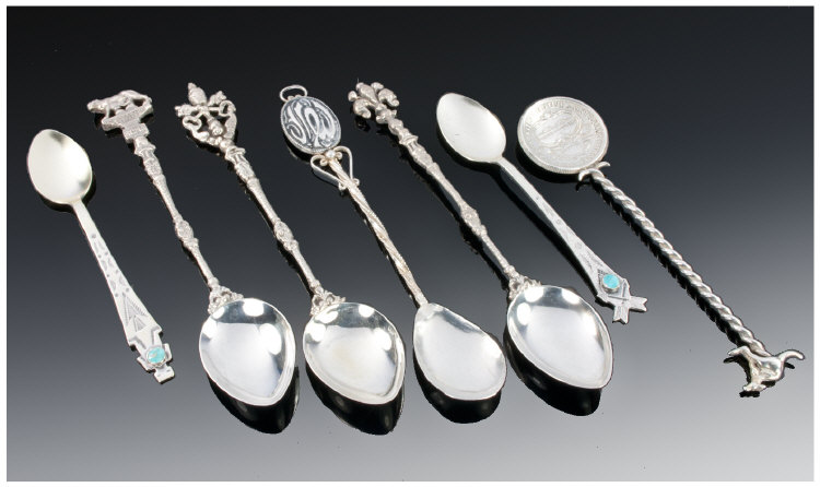 A Group of Seven Silver Spoons. Three Italian (800 standard) silver spoons with Roman themed finials