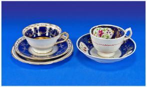 Mid 19th Century Cup and Saucer, in Royal blue and white, with simple floral panels and copper