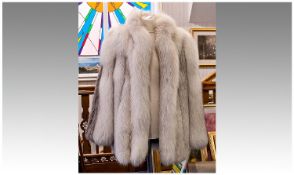 Silver Fox Fur Jacket. Wide Sleeves with high front fastening. Fully lined in silver grey sateen