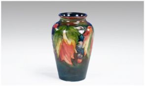 William Moorcroft Flambe Leaves and Berries Small Vase. Signed to base, height 4.25 inches.