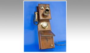 Wall Hanging Old Fashioned Telephone with brass fittings and round dial.