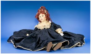 Large Victorian Style Doll in navy blue taffeta dress with cream lace trim to neck, sleeves and hem,