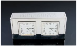 A Stylish Twin Dial White Metal Desk Clock Of Rectangular Shape. Stamped to the reverse Links of
