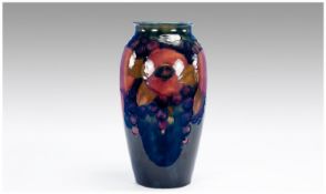 William Moorcroft Signed Vase. ``Pomegranate and Berries`` design on blue ground, c. 1920`s.