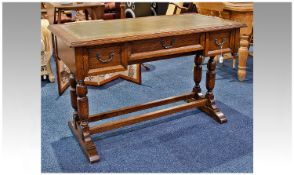 Mid 20th Century Oak Writing Desk, leathered top, fitted with central drawer flanked to each side by