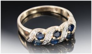 9ct Gold Diamond And Sapphire Ring, Set With Six Round Cut Sapphires Between Diamond Spacers,