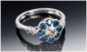 18ct White Gold Diamond And Sapphire Ring, Central Round Cut Diamond Surrounded By Round Cut
