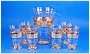 Mid 20th Century Retro Lemonade Set, comprising jug and six beakers, all with a central band of gold