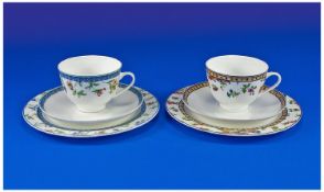 Two Coalport Trios, from the `Country Garden Collection`, one titled `Floral Breeze`, the other