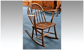 Small Ercol Rocking Chair, with beech frame and fitted with elm seat, original Ercol label to back