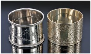 Two Silver Napkin Rings. 1. A Victorian ring with fleur-de-lys decoration and vacant cartouche.