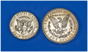 A 1921 American Dollar and a 1964 half dollar, (featuring John F. Kennedy)