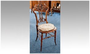 Early Victorian Walnut Bedroom Chair, the back with an integrated Laurel Wreath surrounded by